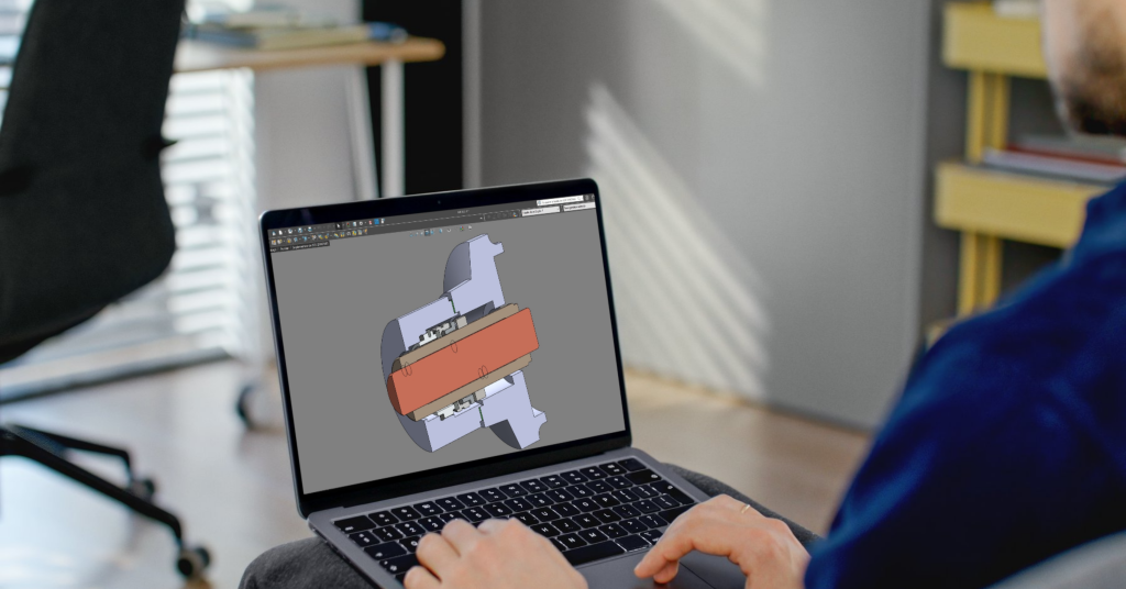 Engenheiro desenvolvendo modelo 3D de selo mecânico engenheirado no SolidWorks, projetado sob medida para aplicações industriais.