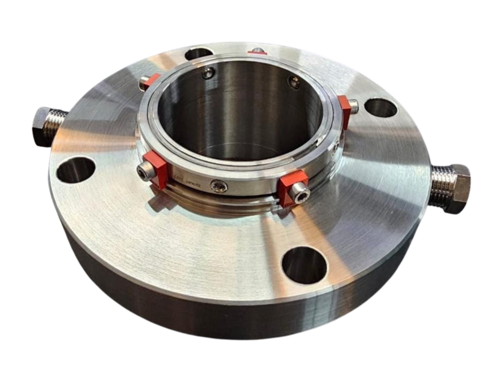 Fotografia de um selo mecânico industrial utilizado em bombas e compressores, responsável por garantir a estanqueidade de fluidos sob pressão e rotação.